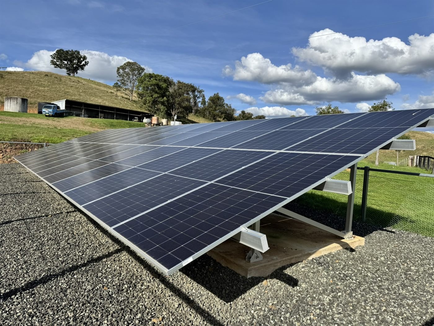 Off-grid ground-mount solar array with rolling hills